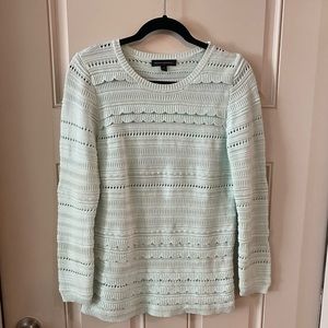 Aqua, light blue sweater.